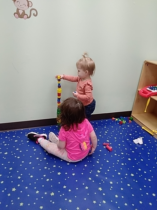 2022 Stepping Stones Childcare two and three year olds two girls stacking blocks
